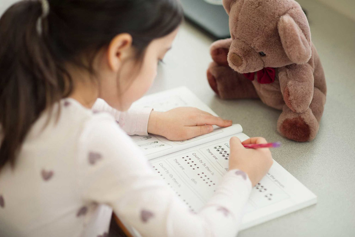 A child working on a paper